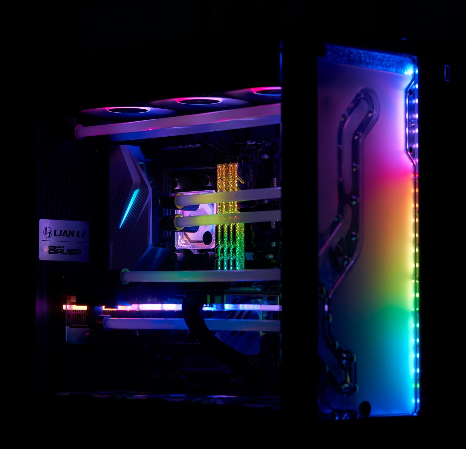 Un PC gaming de gama alta con iluminación RGB vibrante en ventiladores, RAM y refrigeración líquida, mostrando la complejidad de los componentes a sincronizar.