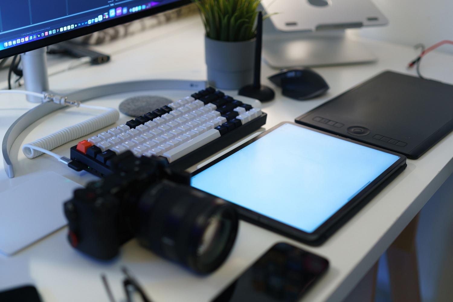High-end home office setup with photography and video editing gear, symbolizing high production quality.