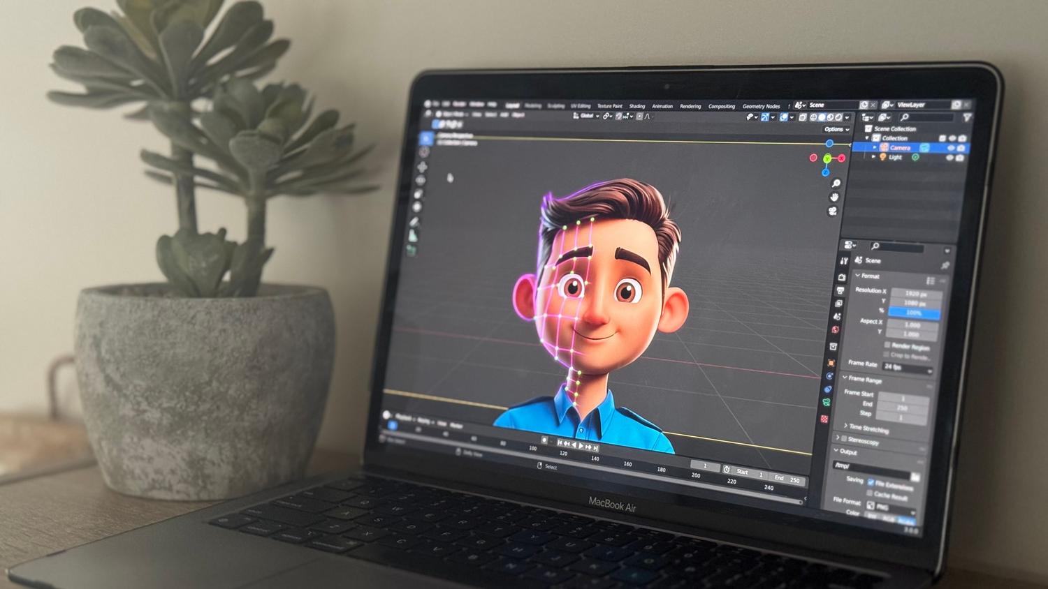 Laptop mostrando una animación 3D en un espacio de trabajo creativo.